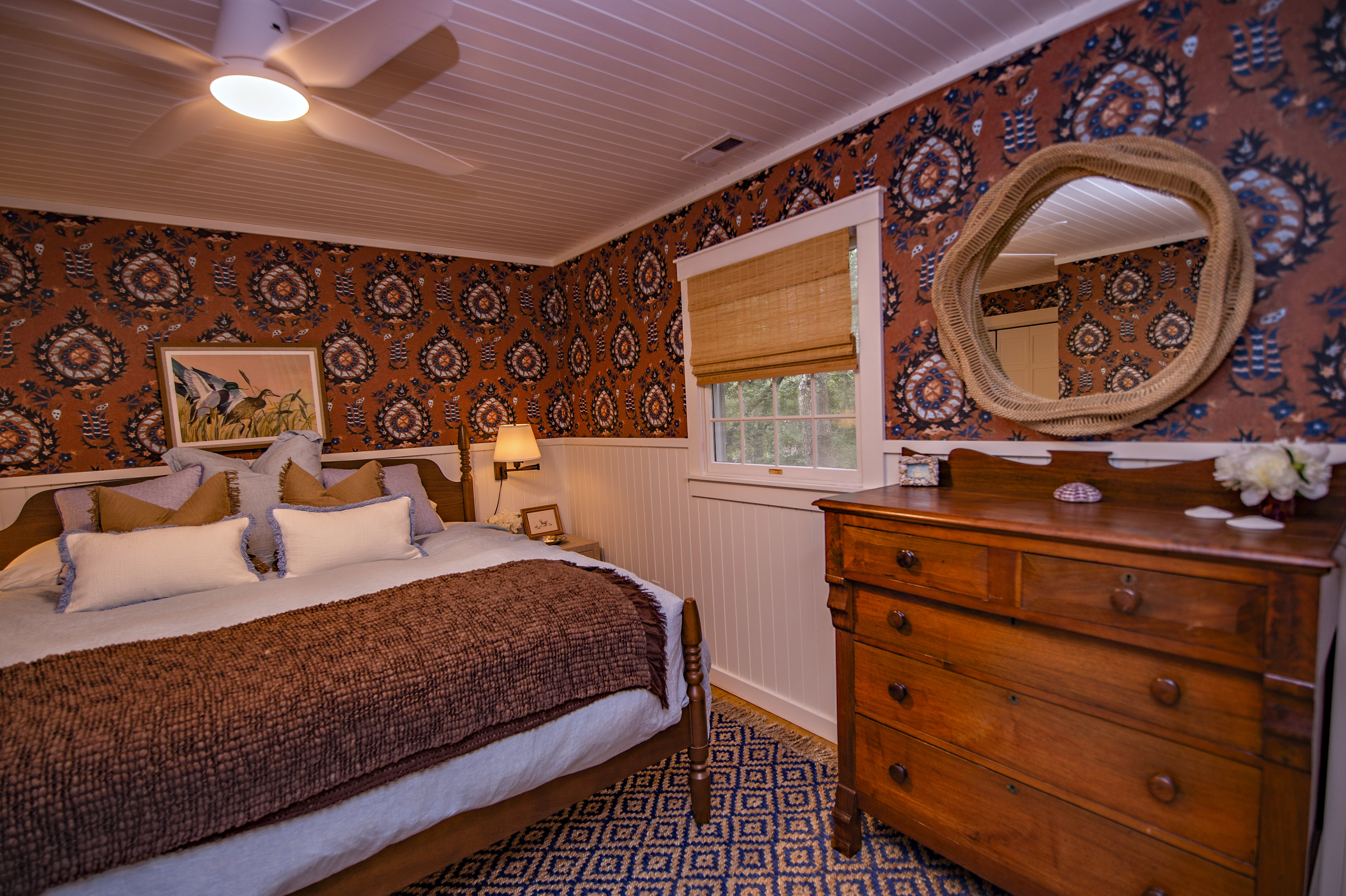 King bedroom with bold wallpaper